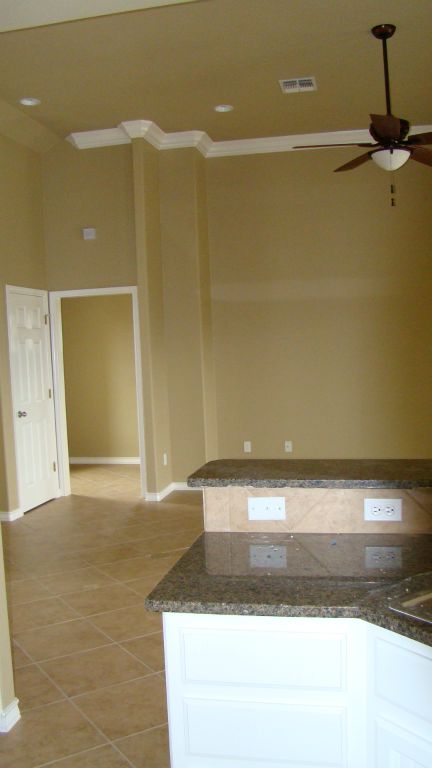VIEW FROM KITCHEN TO LIVING ROOM with HIGH CEILINGS